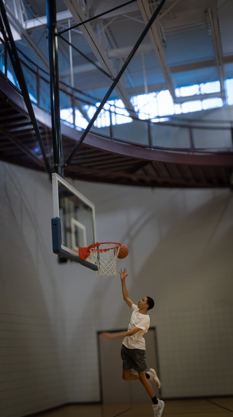 Player finishing at the rim during a development session.