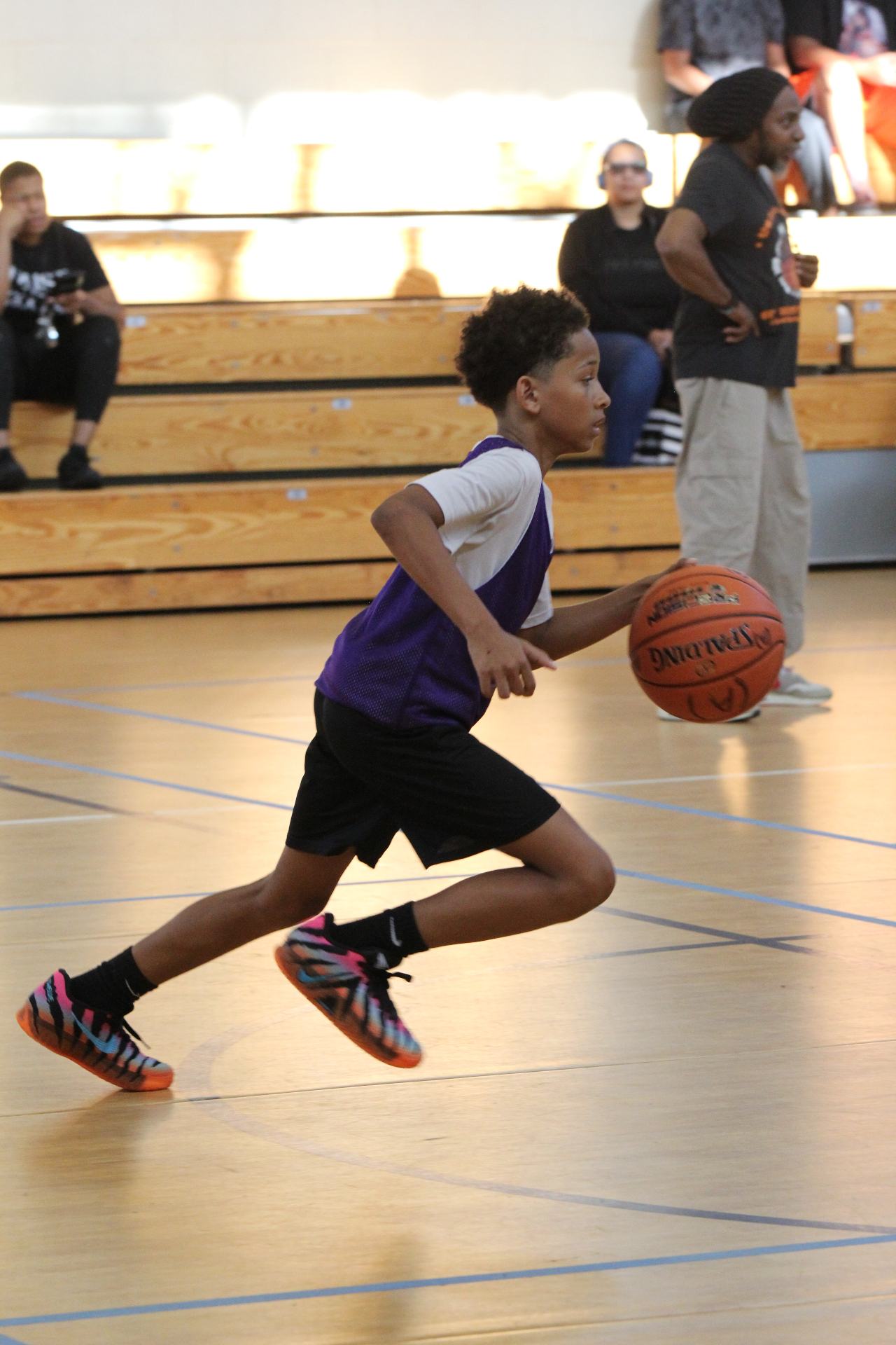 Young athlete driving to the basket during a Full Court Press scrimmage.