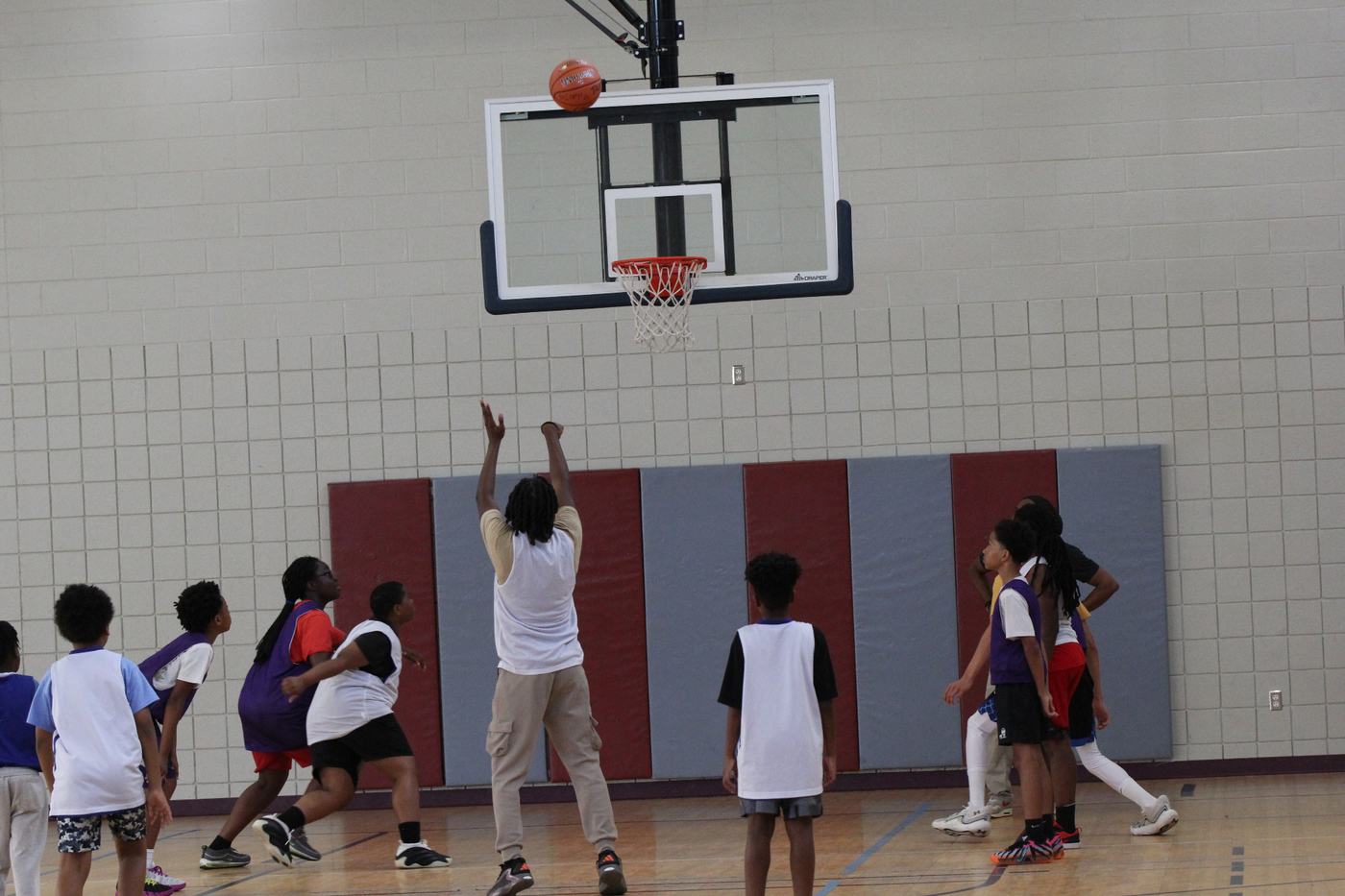 Player finishing at the rim during a development session.