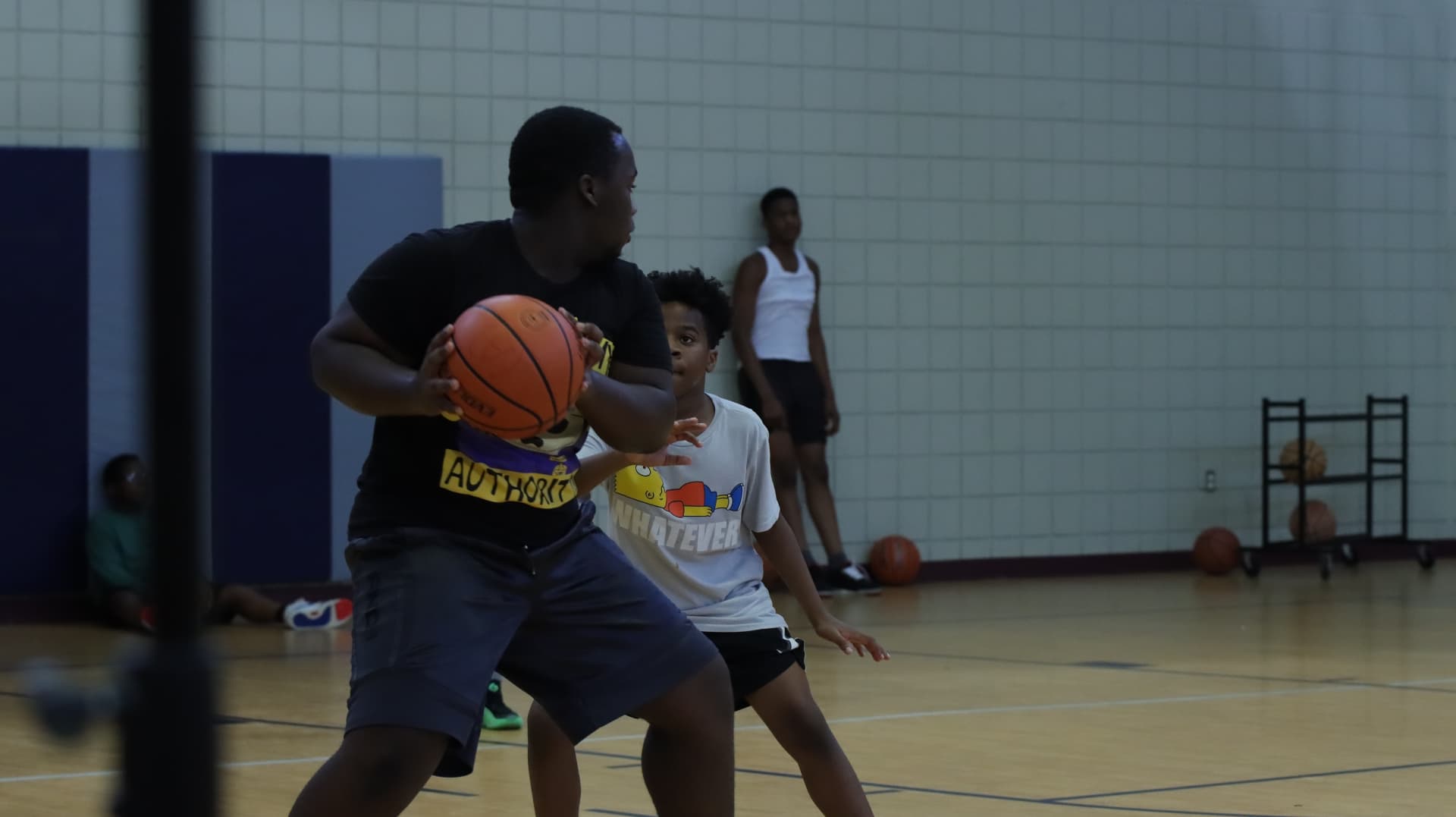 Two Advanced Fundamentals players in a defensive stance during a drill