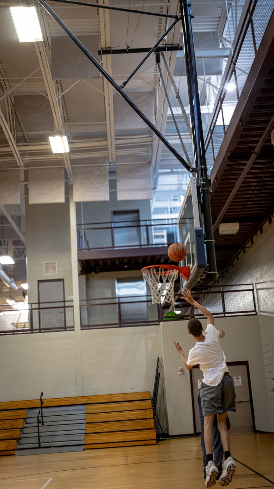 TAONI Basketball athlete finishing at the rim during practice
