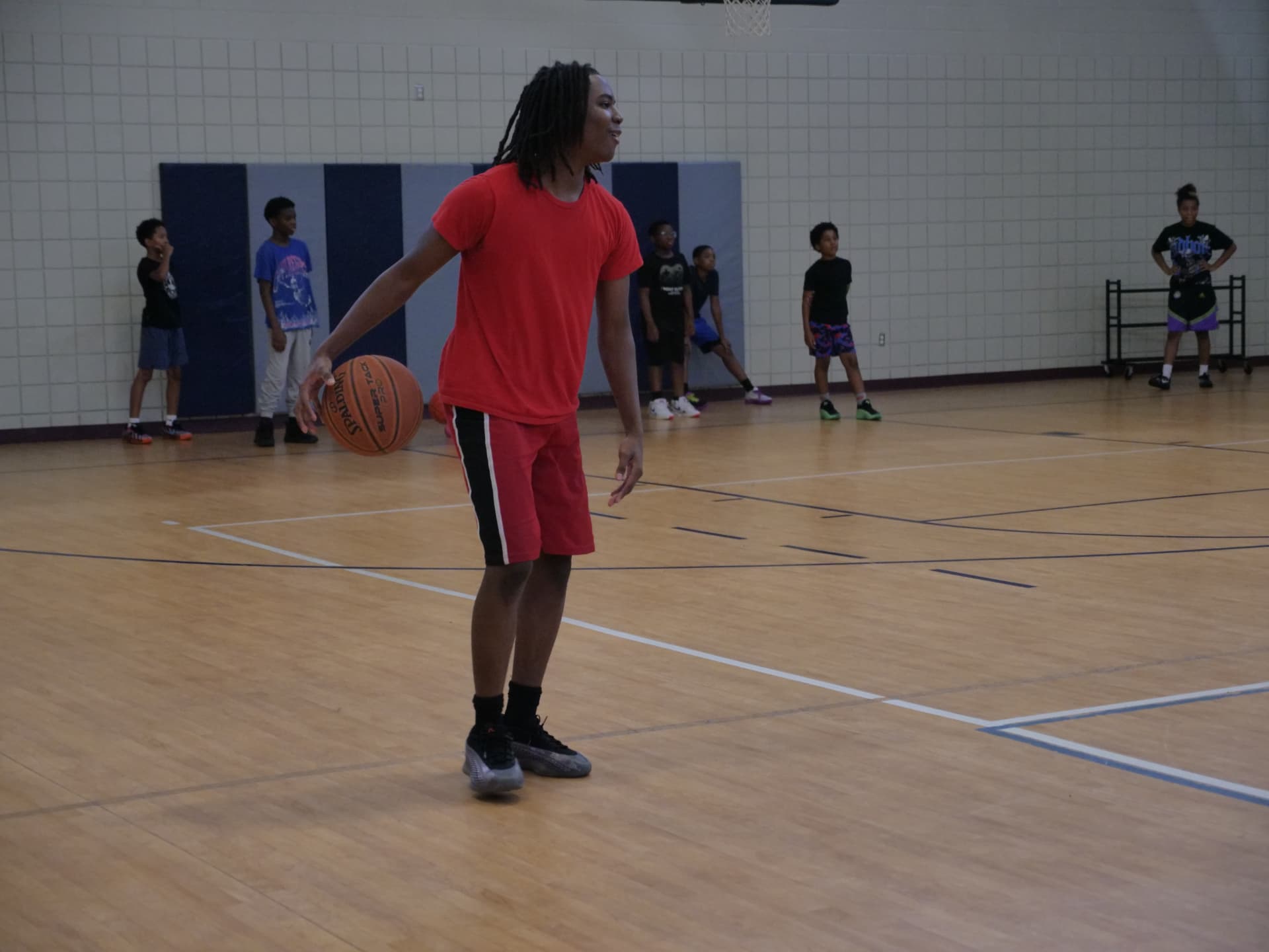 Advanced Fundamentals athlete working a dribble drill on the court